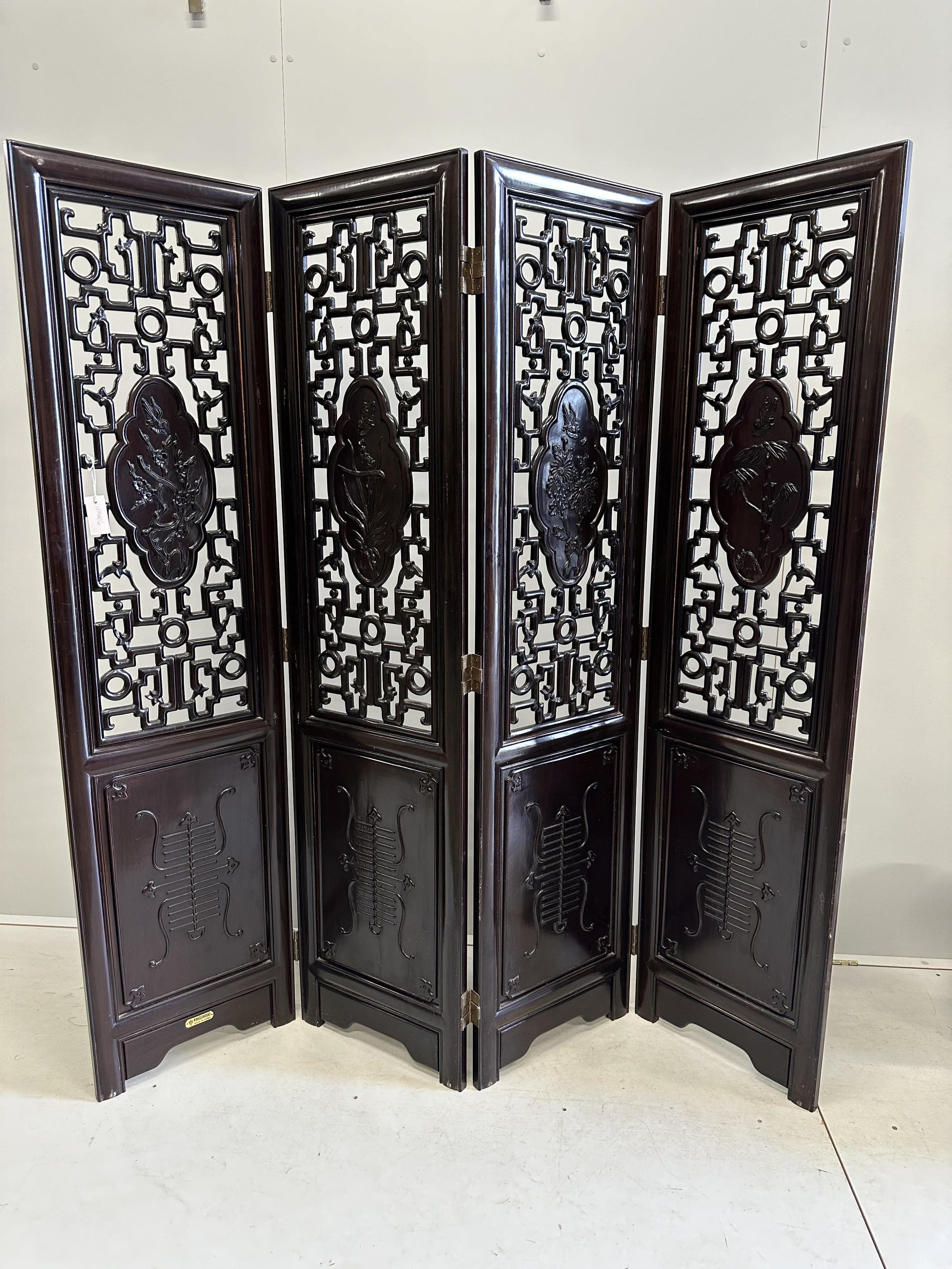 A Chinese carved hardwood four fold screen, each panel width 45cm, height 183cm. Condition - good